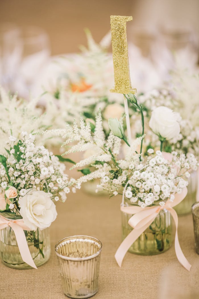 Charming floral arrangement with white roses and baby's breath on a wedding table in Kowloon, Hong Kong.